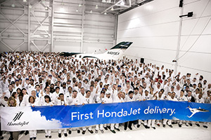 Honda Aircraft Company associates celebrate the first HondaJet delivery.