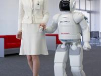 ASIMO holding hands with human