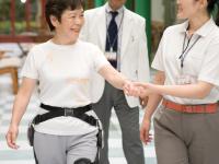 Rehabilitation training with Honda's walking assit device with a doctor and a physical therapist (image)