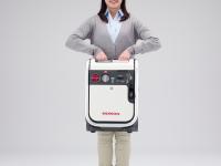 Gas-Powered Generator ENEPO Lifting Image in Both Hands