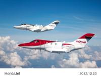 First (silver) and third (red) models of HondaJet for certification flight tests