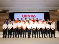 Managing Officer and Director, Masahiro Yoshida, with all riders, drivers  team directors
