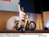 Takahiro Hachigo, President and Representative Director, Chief Executive Officer, Honda Motor Co., Ltd. with Super Cub 110