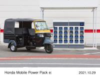 Honda Mobile Power Pack Exchanger e: (planned mass-production model) and an electric rickshaw