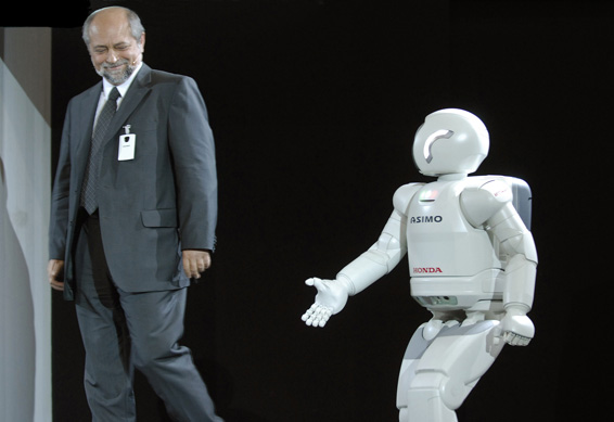 The new ASIMO introduces Professor Edgar Koerner, President of HRI (Europe) to the stage