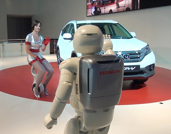 ASIMO greets the U3-X rider on the Honda stand