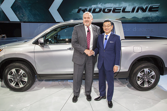 John Mendel, executive vice president, Automobile Division, of American Honda Motor Co., Inc., and Takahiro Hachigo, president & CEO of Honda Motor.Co., Inc., present the all-new 2017 Honda Ridgeline on January 11 at the 2016 North American International Auto Show in Detroit.