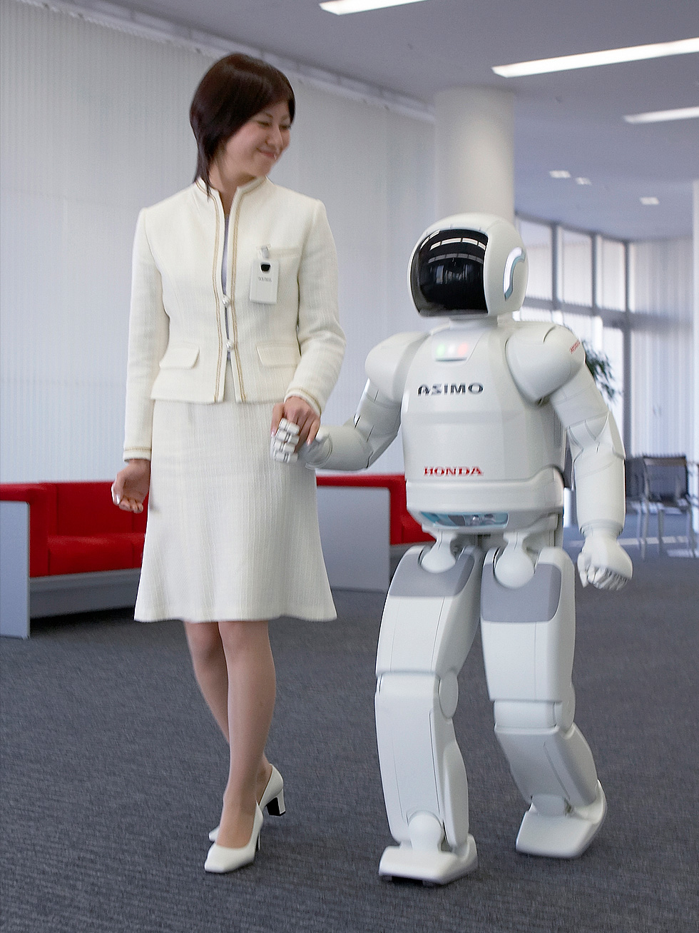 ASIMO holding hands with human