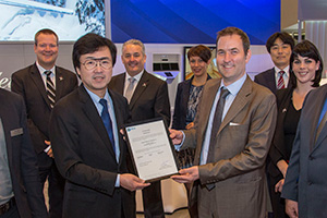 Steven Higgins, European Aviation Safety Agency Section Manager of High Performance Aircraft and Turboprops, presents the EASA type certificate for the HA-420 HondaJet to Honda Aircraft Company President and CEO Michimasa Fujino.