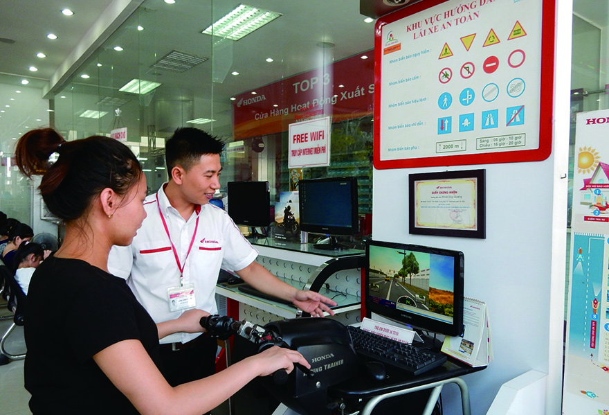 Riding safety promotion activities provided at a motorcycle dealership (Vietnam)