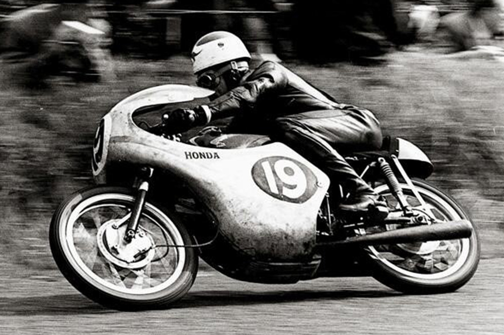 Tom Phillis on his RC143 gives Honda its first victory