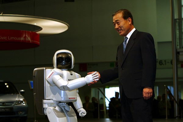 ASIMO and Takeo Fukui, President and CEO of Honda Motor Co., Ltd.