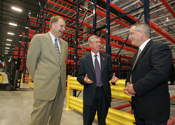 American Honda Motor Co. Inc. opened its $89 million Midwestern Consolidation Center today, where parts from Honda's U.S. plans and 525 U.S. supplier plants will be packaged and distributed to smaller Honda facilities, and then on to more than 1,200 Honda and Acura dealers. From left, Bruce T. Smith, company assistant vice president, discusses the new facility with Troy Mayor Michael L. Beamish and company Senior Manager Tony Gomes. (Photo by Paul Vernon.)