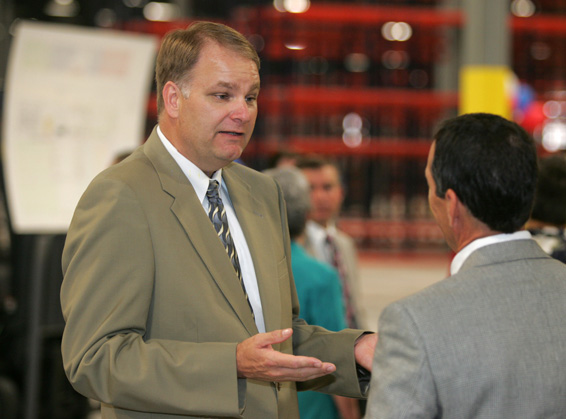 American Honda Motor Co. Inc. Assistant Vice President Bruce T. Smith discusses with a visitor Honda's new $89 million Midwestern Consolidation Center. This master hub operation opened today. Parts from Honda's U.S.vehicle plants and 525 U.S. suppliers are packaged here, shipped to smaller Honda warehouses and then on to dealers. (Photo by Paul Vernon.)