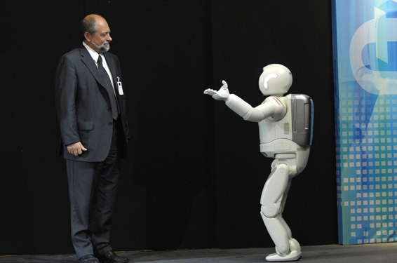 The new ASIMO introduces Professor Edgar Koerner, President of HRI (Europe) to the stage