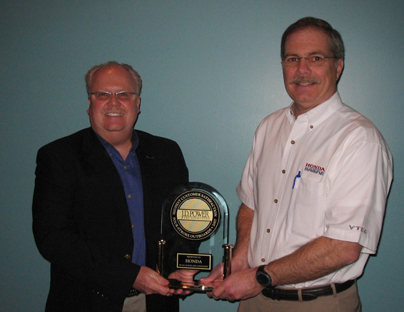 John Fulcher (left), senior manager, Honda Marine and Steve Bailey, vice president, Honda Power Equipment, receive the 2007 J.D. Power Award for Satisfaction with Four-Stroke Outboard Engines.