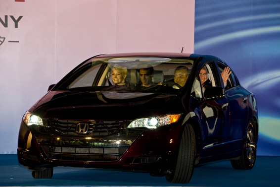 Honda Motor Co., Ltd. president and CEO Takeo Fuk takes some of the initial FCX Clarity customers for a quick drive during a ceremony on June 16, 2008, for the start of production. The ceremony took place at the world's first dedicated fuel cell vehicle manufacturing facility, located in Tochigi, Japan.