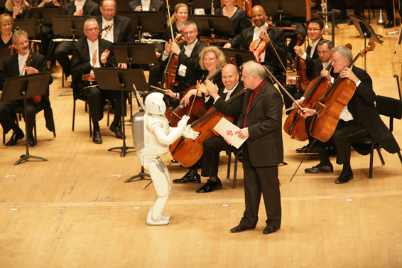 Honda's ASIMO humanoid robot joins internationally-recognized American conductor and Detroit Symphony Orchestra Music Director Designate Leonard Slatkin on stage prior to a special sold-out performance with Yo-Yo Ma at Orchestra Hall the evening of Tuesday, May 13, 2008. ASIMO debuted its ability to conduct when it led the orchestra in a short work called "The Impossible Dream" from Man of La Mancha by Mitch Leigh.