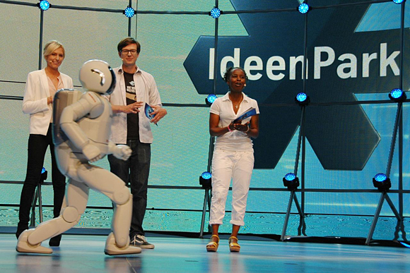 Blink and you'll miss it - ASIMO, running with two feet off the ground, wows the crowds at IdeenPark, Essen, Germany