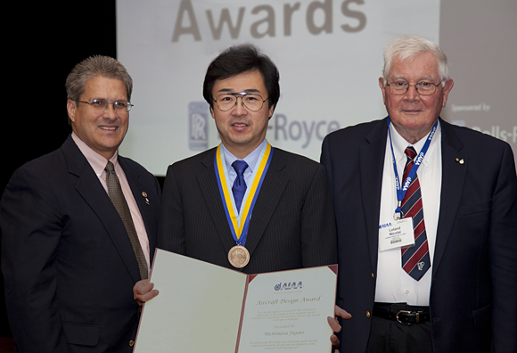 AIAA 2012 Aircraft Design Award presentation. From left to right: Dr. Neal Pfeiffer, AIAA Technical Director and Fellow, Michimasa Fujino, Honda Aircraft Company President and CEO, Dr. Leland Nicolai, 2011 AIAA Aircraft Design award recipient (Lockheed Martin Skunk Works).