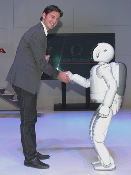 ASIMO greets Olympic show jumping gold medallist, and Hondas recently appointed ambassador in Switzerland, Steve Guerdat at the show's opening party