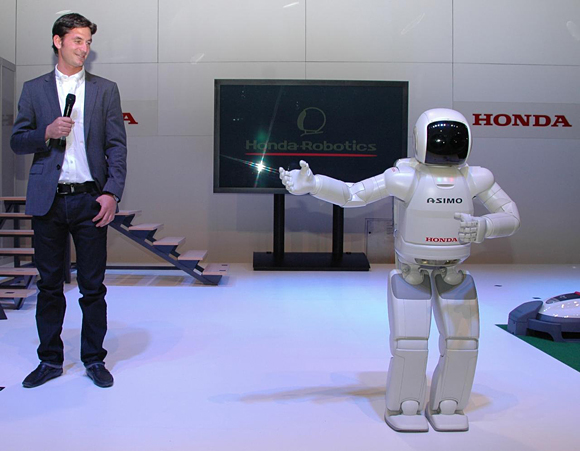 ASIMO greets Olympic show jumping gold medallist, and Hondas recently appointed ambassador in Switzerland, Steve Guerdat at the show's opening party