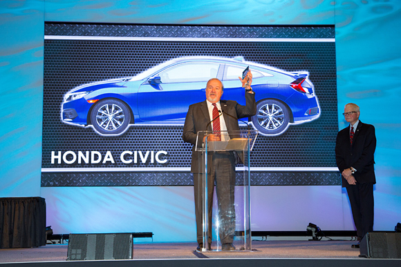 John Mendel, executive vice president of the Automobile Division of American Honda Motor Co., Inc., accepts the North American Car of the Year Award for the all-new 2016 Honda Civic.