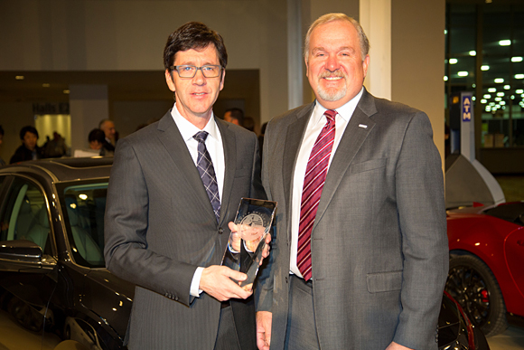 John Mendel, executive vice president of the Automobile Division of American Honda Motor Co., Inc., and Gary Evert, North American Development Leader for Civic, Honda R&D Americas, with the North American Car of the Year Award presented for the all-new 2016 Honda Civic.