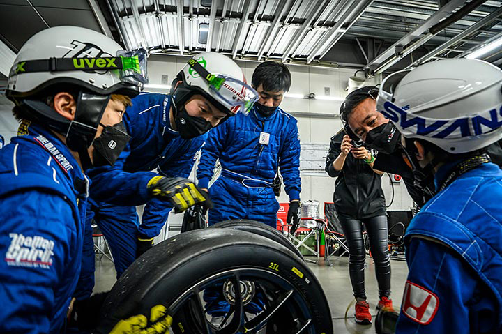 Young team members listen intently as they receive instructions.