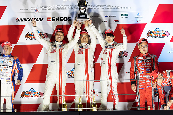 The podium ceremony at the final round at Fuji, where HRDC secured the championship