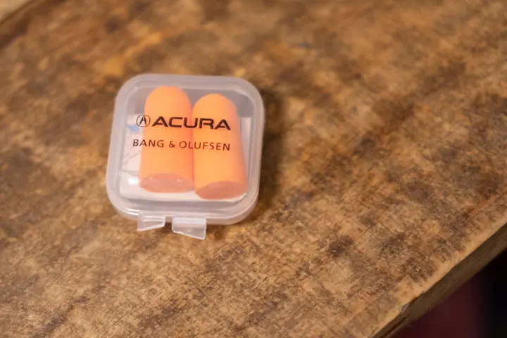 The Acura logo appears on ear plugs handed out to officials.