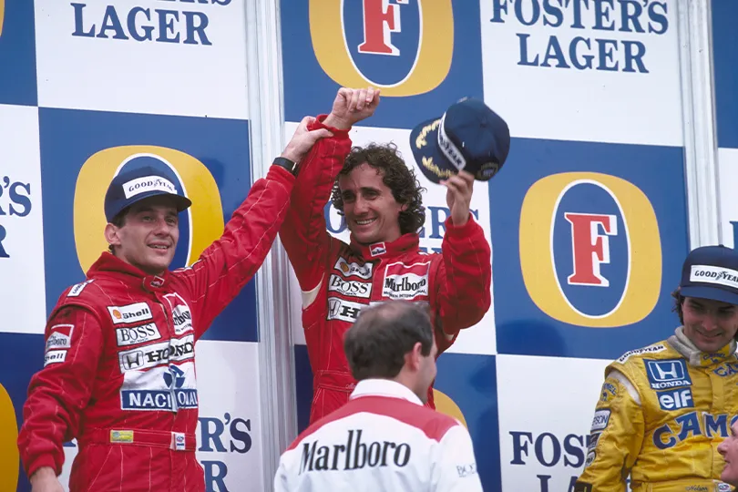 Ayrton Senna (left) . The Brazilian racing driver who won three F1 world championships, Ayrton Senna made his F1 debut in 1984 with British team Tallman, and went on to drive for Lotus, McLaren, and Williams. He passed away at the young age of 34 due to a racing accident at the San Marino Grand Prix in 1994.