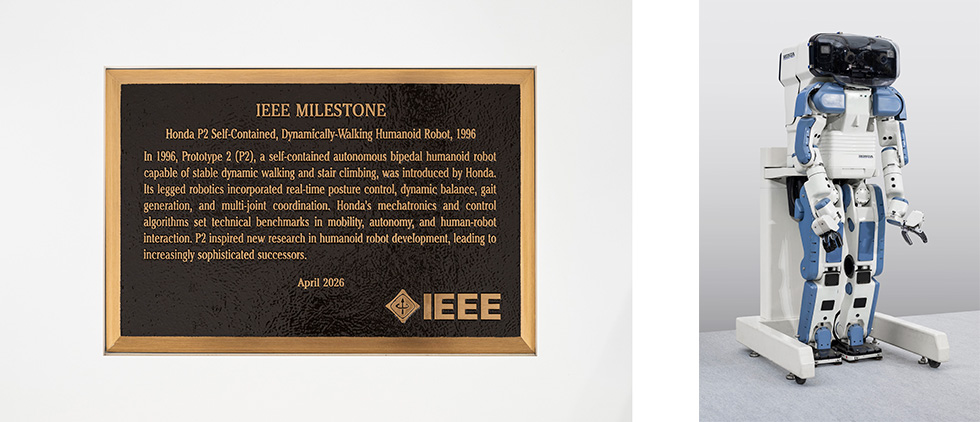 IEEE Milestone plaque (left) and Honda P2 bipedal humanoid robot (right)