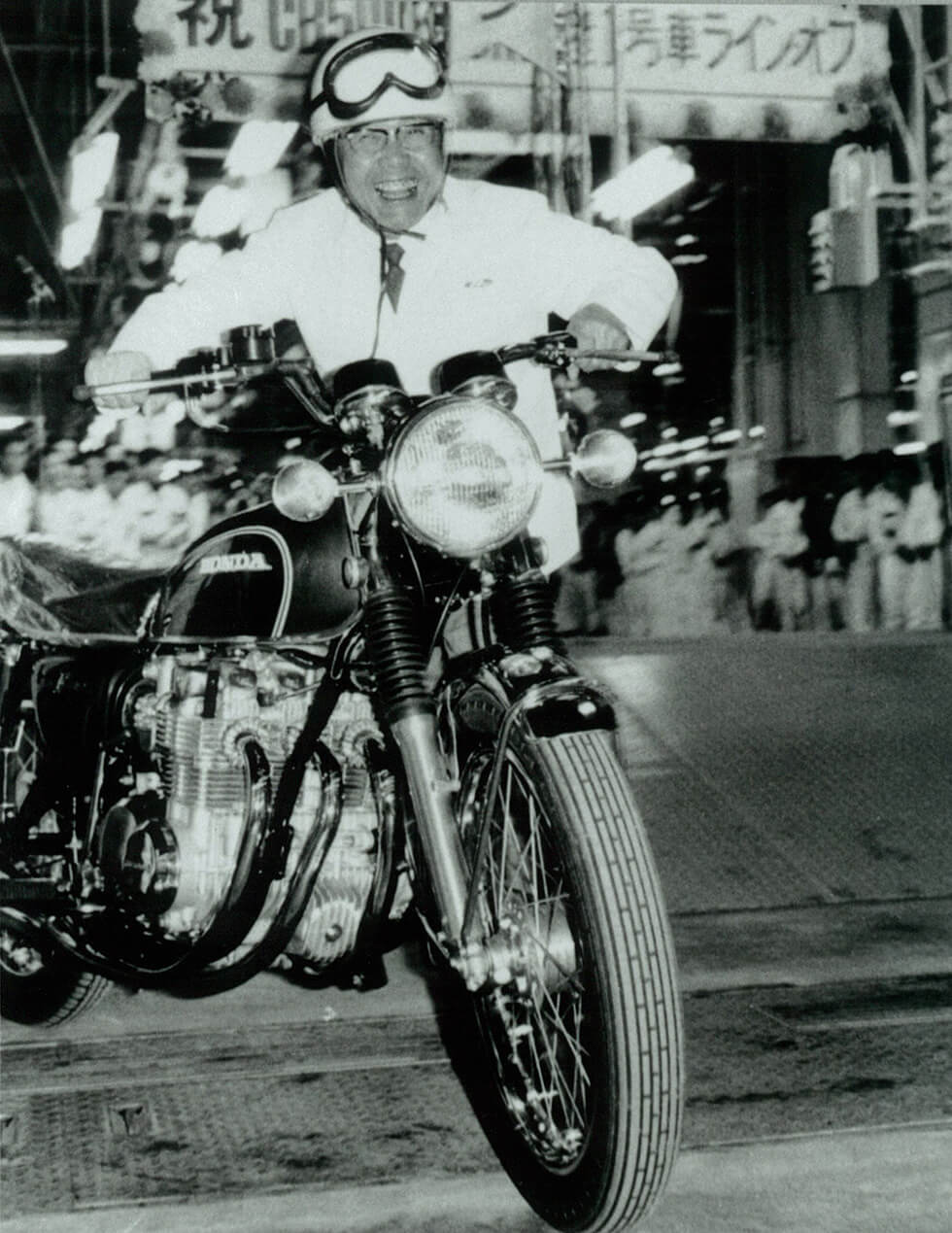 Circa March 1971<br />Honda President Soichiro Honda and the first mass-produced CB500 FOUR at the line-off ceremony at Hamamatsu Factory.