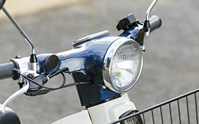 Position Lamp In 1989, the Press Cub’s standard headlight was reconfigured as a hand-operable position lamp, which proved convenient for checking notes of delivery routes, as well as providing nominal illumination for dawn and dusk deliveries.