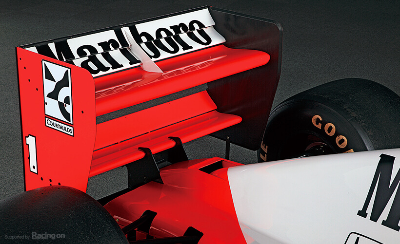 Lower wing mount introduced for the first time. Rear wing is large to accommodate the huge V12 power.