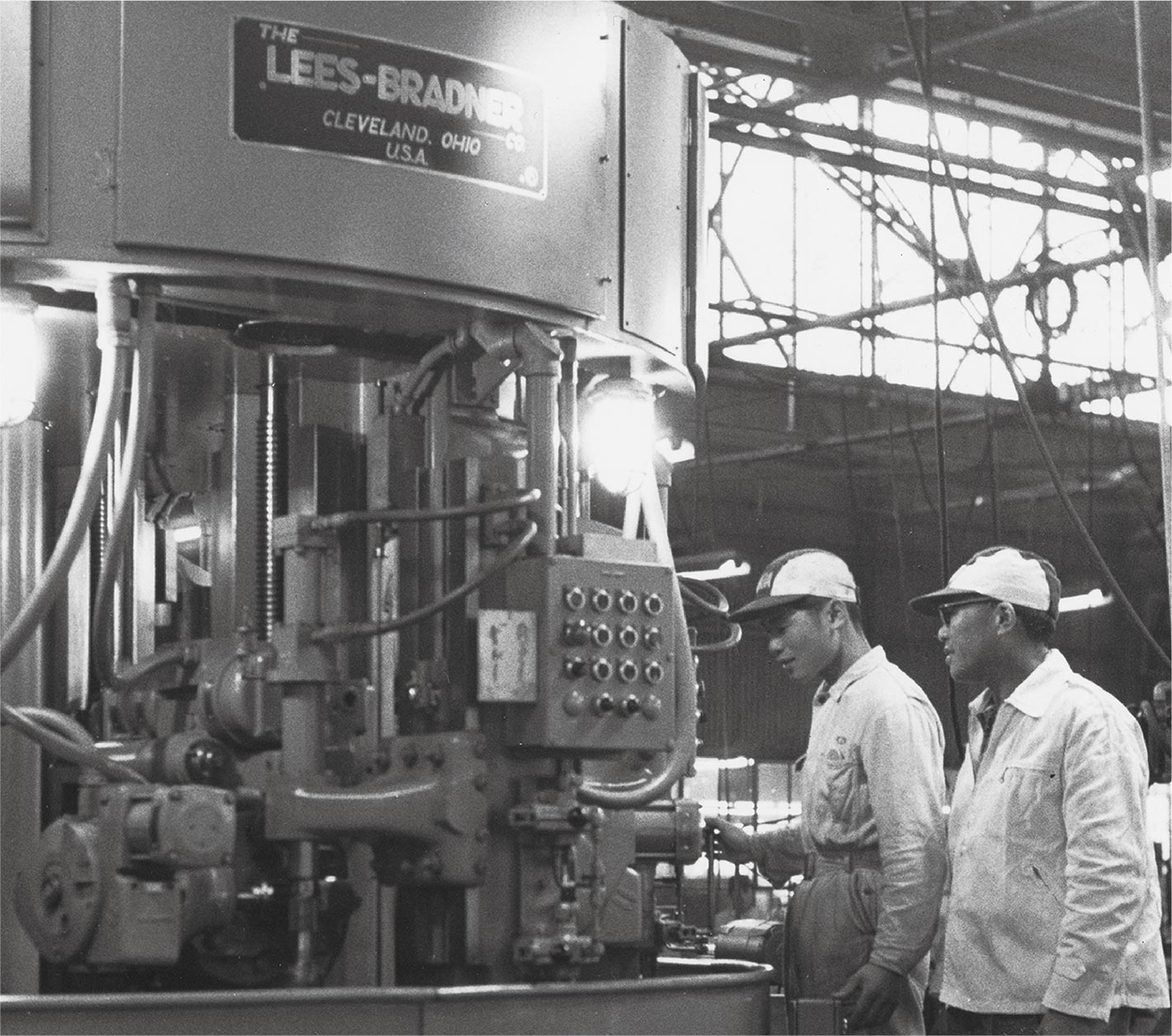 Soichiro Honda (right) with machine tools purchased from the U.S.