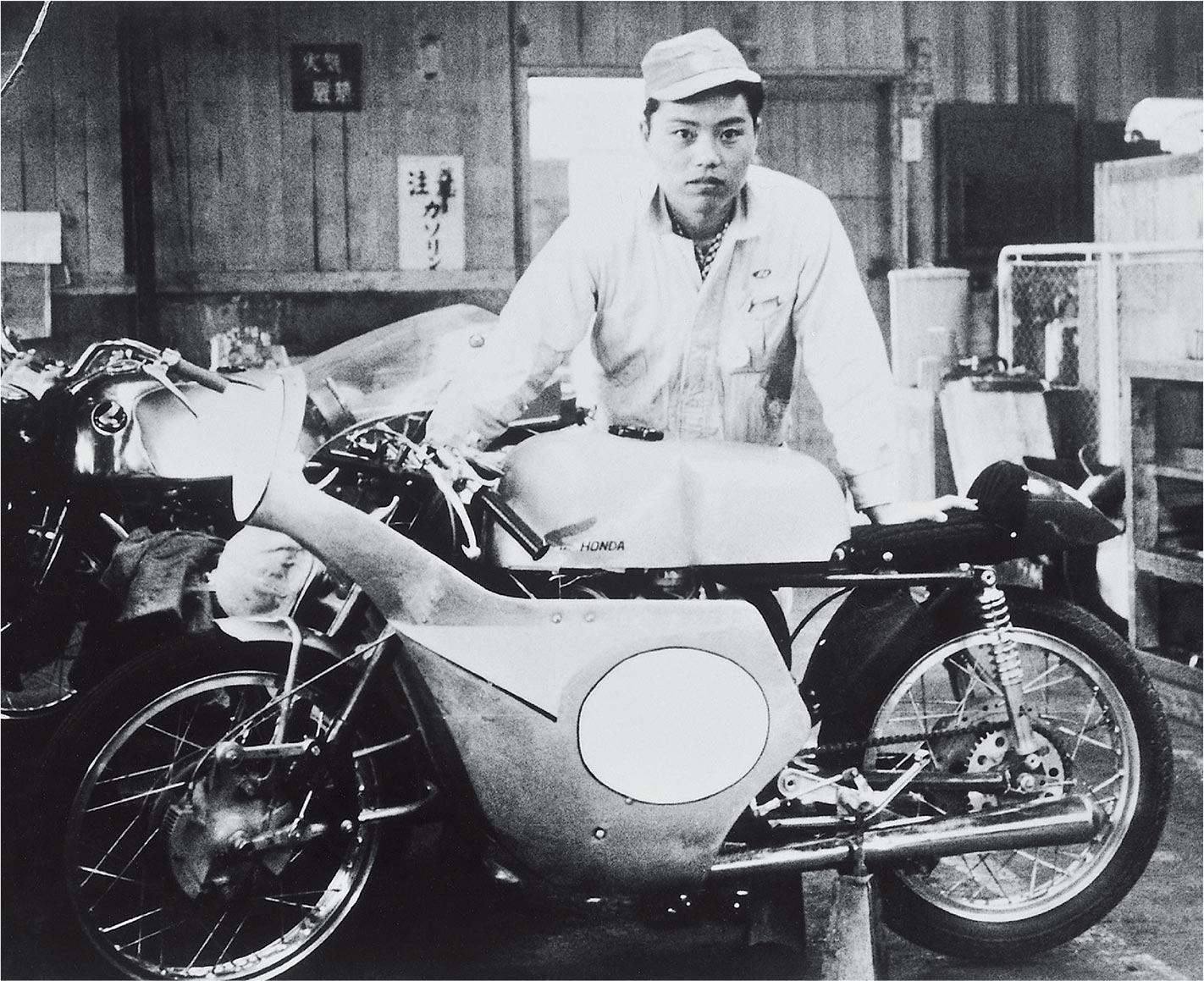 Tadashi Kume with the RC141 he was involved in developing.