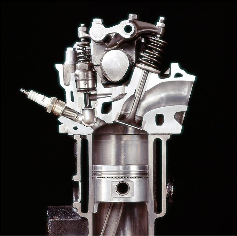 CVCC combustion chamber cutaway model with spark plug and gasoline injection nozzle in the secondary combustion chamber