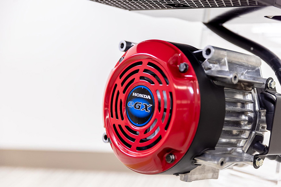eGX (separated). External fan can be seen through the red mesh. The aluminum motor housing has cooling fins.
