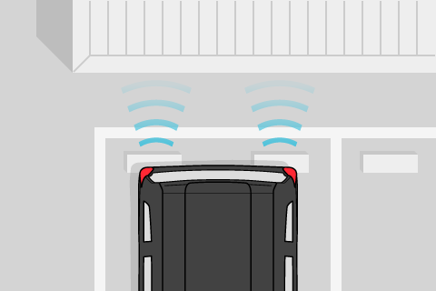 While reversing in a location such as a store parking lot, sonar sensors detect obstacles to the rear of the vehicle.
