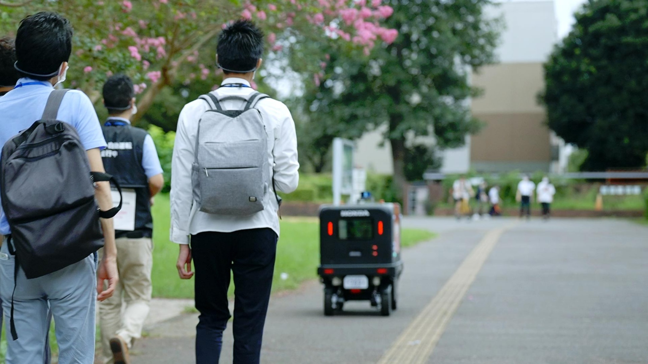 Robots face many different situations involving pedestrians and cyclists passing around them.