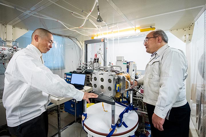 Fuel cells under development (photo center) are being tested at JAXA’s Tsukuba Space Center.